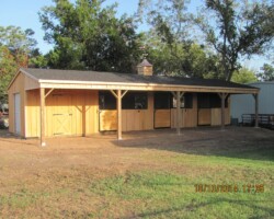 shedrow horse barn with over hang